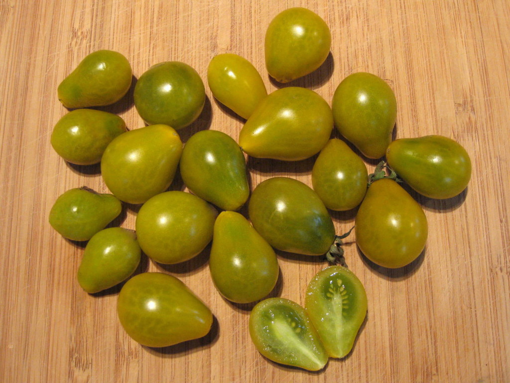 Green when ripe fruits, althought these have yellow skin so take on an amber hue when ripe. Picture Jayb.